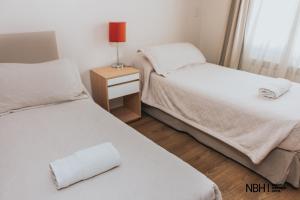 Postel nebo postele na pokoji v ubytování NBH Nativo Boutique Hotel