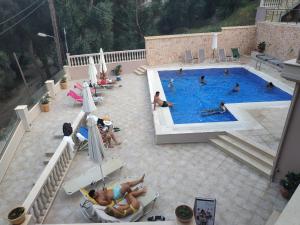 a group of people in a swimming pool at Michaelangelo in Parga