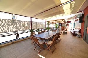 a dining room with a table and chairs on a balcony at B&B Patty's House in Adrano