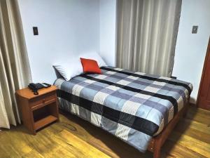 Postel nebo postele na pokoji v ubytování Real House Cusco