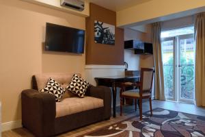 A television and/or entertainment centre at Hotel Paradis Suite Cusco
