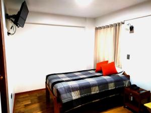 Postel nebo postele na pokoji v ubytování Real House Cusco