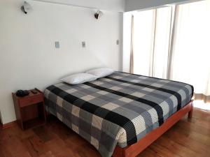 Postel nebo postele na pokoji v ubytování Real House Cusco