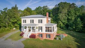 an aerial view of a house with a porch at Hill of Content B&B in Radiant