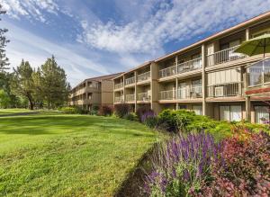 an exterior view of a building with a garden at WorldMark Eagle Crest in Redmond