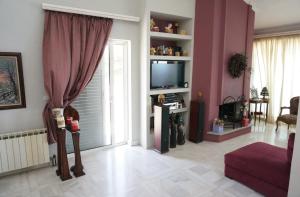 TV a/nebo společenská místnost v ubytování Sea Side Villa Alexandra