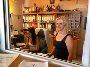 a woman standing in front of a mirror at Paradise Apartments in Laganas