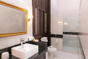 a bathroom with a sink and a toilet and a shower at Hotel Lavanda Merida in Mérida +67 photos