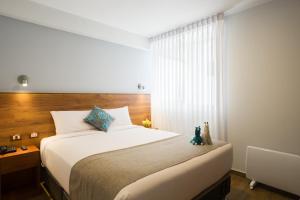 Katil atau katil-katil dalam bilik di Muru Homely Hotel Cusco