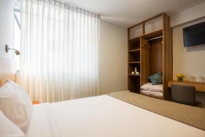 Katil atau katil-katil dalam bilik di Muru Homely Hotel Cusco