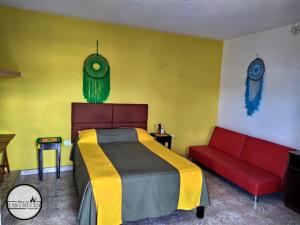 Voodi või voodid majutusasutuse Hostal Las Cruces toas