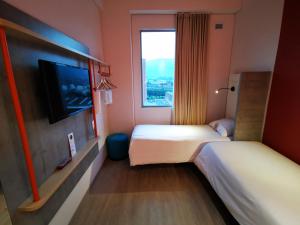ibis budget Medellín Itagüí Metro客房内的一张或多张床位
