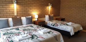 Ένα ή περισσότερα κρεβάτια σε δωμάτιο στο Sandpipers @ Millicent