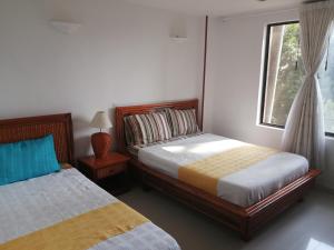 Postel nebo postele na pokoji v ubytování Girardot Resort