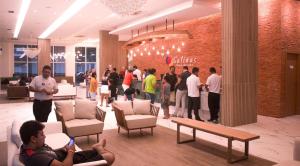 a group of people standing in a store lobby at Salinas Park Resort in Salinópolis