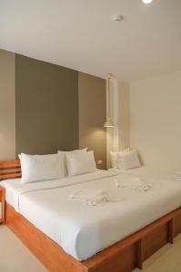Säng eller sängar i ett rum på Krabi Pitta House