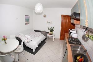 Kuchyň nebo kuchyňský kout v ubytování Apartman Malina