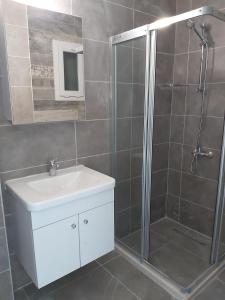 a bathroom with a shower and a sink and a shower at Ardem 5 Girne Luxury 1+1 in Kyrenia