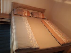 a bunk bed with two pillows on top of it at Apartmán Pavilón D-PETER in Nový Smokovec