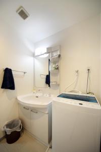 Ванная комната в EX Itoman Apartment 502