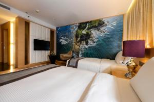 Voodi või voodid majutusasutuse Horizon Hotel toas