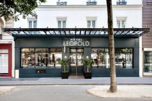 a store front of a store with a sign on it at Hôtel Léopold - Orso Hotels in Paris