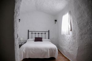 Cama o camas de una habitación en Casas Cueva Molino Fuencaliente