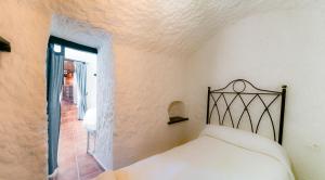 Cama o camas de una habitación en Casas Cueva Molino Fuencaliente