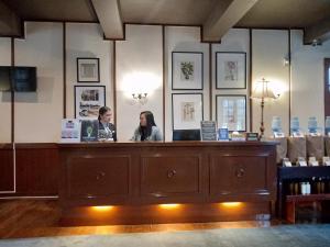 two women sitting at a hair salon counter at Casa Vallejo Hotel Baguio in Baguio