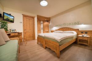 Postel nebo postele na pokoji v ubytování Hotel Garnì COSTANZA