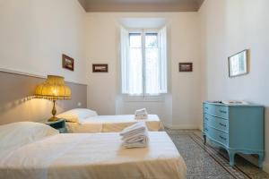 Säng eller sängar i ett rum på Santa Maria Novella 4 bedrooms