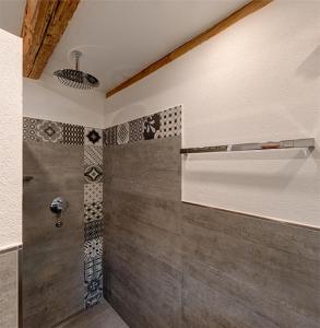 a bathroom with a shower in a room at Ferienhaus Tor zum Allgäu in Vogt