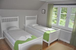Postel nebo postele na pokoji v ubytování Hotel & Pensionat Björkelund