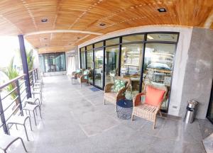 a row of chairs in a building with windows at MGRAND in Roi Et