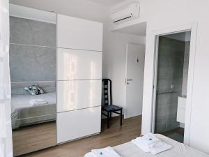 A bed or beds in a room at RomAmourHouse