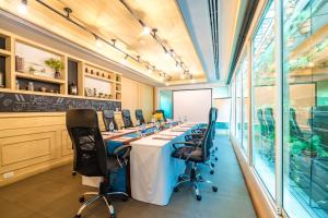 a large conference room with a long table and chairs at Citrus Sukhumvit 11 by Compass Hospitality in Bangkok