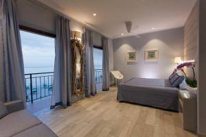 Postel nebo postele na pokoji v ubytování Boutique Hotel Ilio