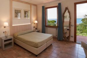 Postel nebo postele na pokoji v ubytování Boutique Hotel Ilio