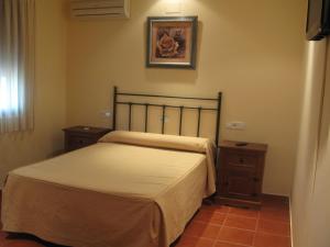 Un pat sau paturi într-o cameră la Hotel El Puerto