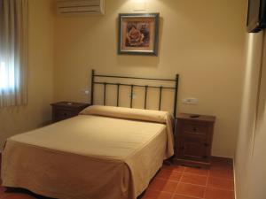 Ένα ή περισσότερα κρεβάτια σε δωμάτιο στο Hotel El Puerto
