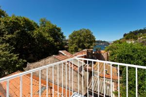a white railing on top of a roof at APOSENTUS - The light house at Miragaia in Porto
