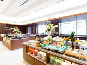 a buffet in a restaurant with food on display at Hotel JAL City Sapporo Nakajima Park in Sapporo
