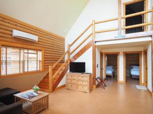 TV a/nebo společenská místnost v ubytování Toscana Log Home