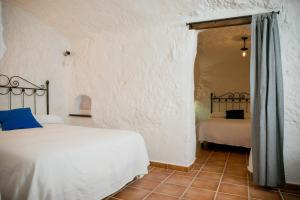 Cama o camas de una habitación en Casas Cueva Molino Fuencaliente