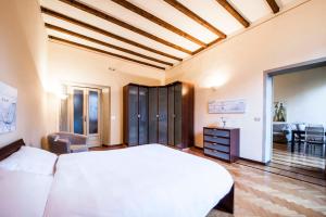 A bed or beds in a room at MERCALLI III