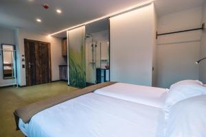 Postel nebo postele na pokoji v ubytování Hotel y Estudios DCeres Estancias