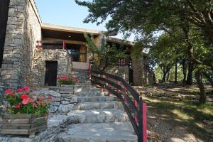 a stone house with stairs leading up to it at VVF Luberon Provence in Murs