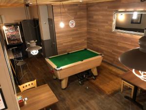 an overhead view of a pool table in a room at The Chlachain Inn in Mallaig