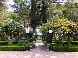 a park with lights and trees and a pathway at Resort Villa Antica in Eboli