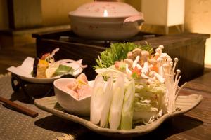 a bowl filled with lots of different types of food at Masutomi Ryokan in Hakone